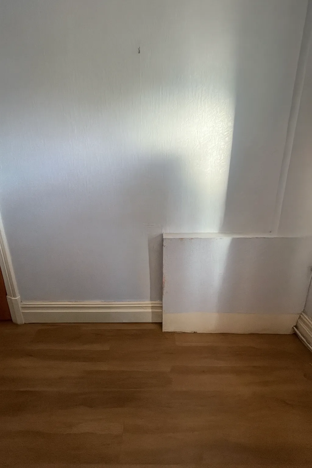 Bedroom wall prepared before the custom headboard was built
