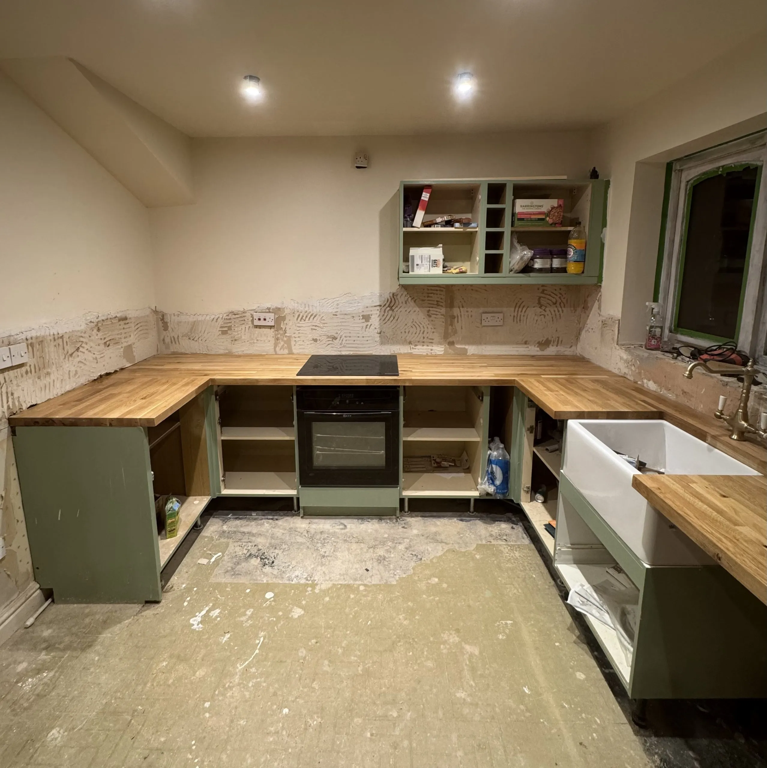Replacement kitchen worktop fitted around the sink and units