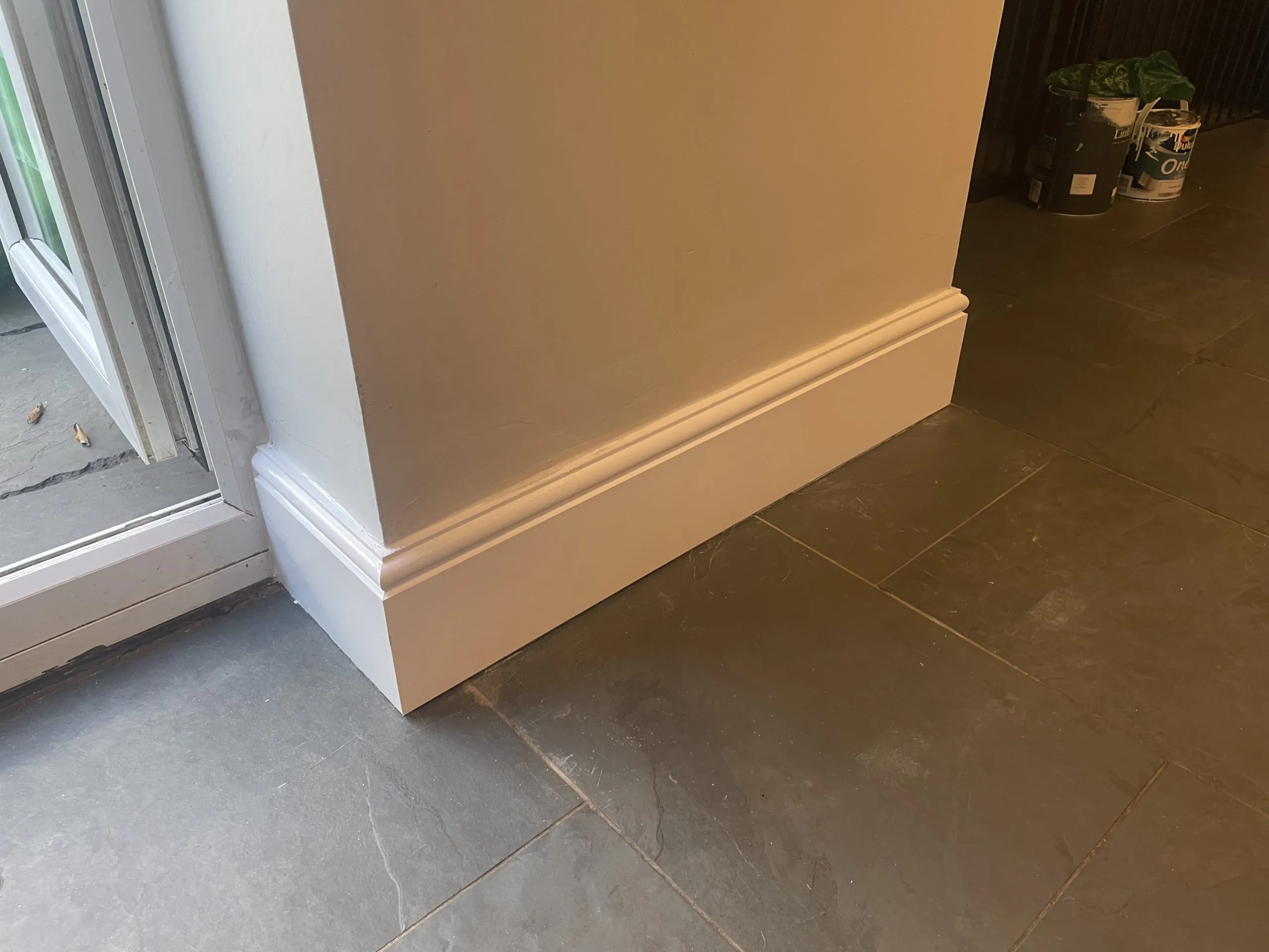 Newly fitted skirting board and paintwork during property maintenance