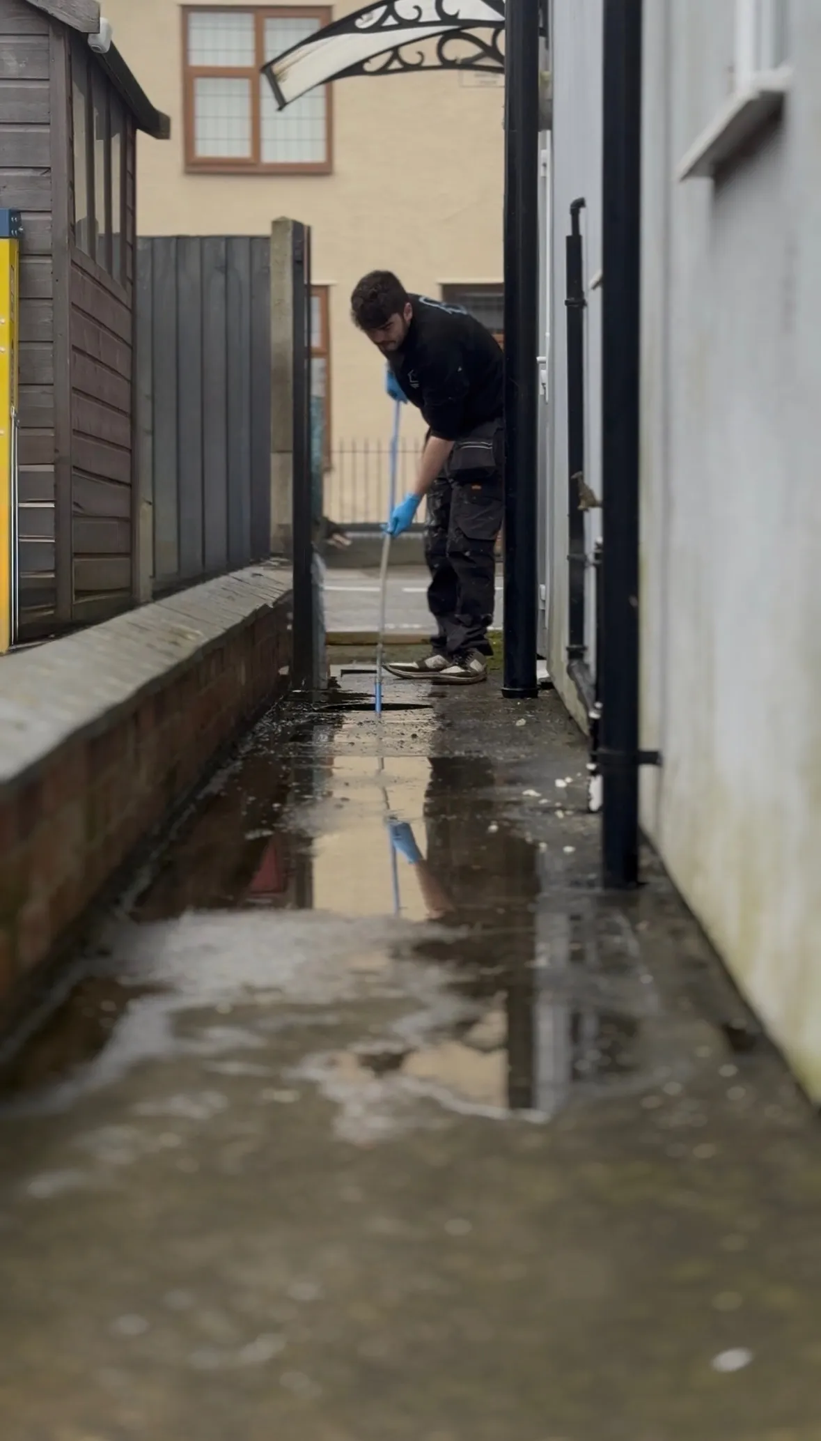 Outside drain gully backing up with standing water