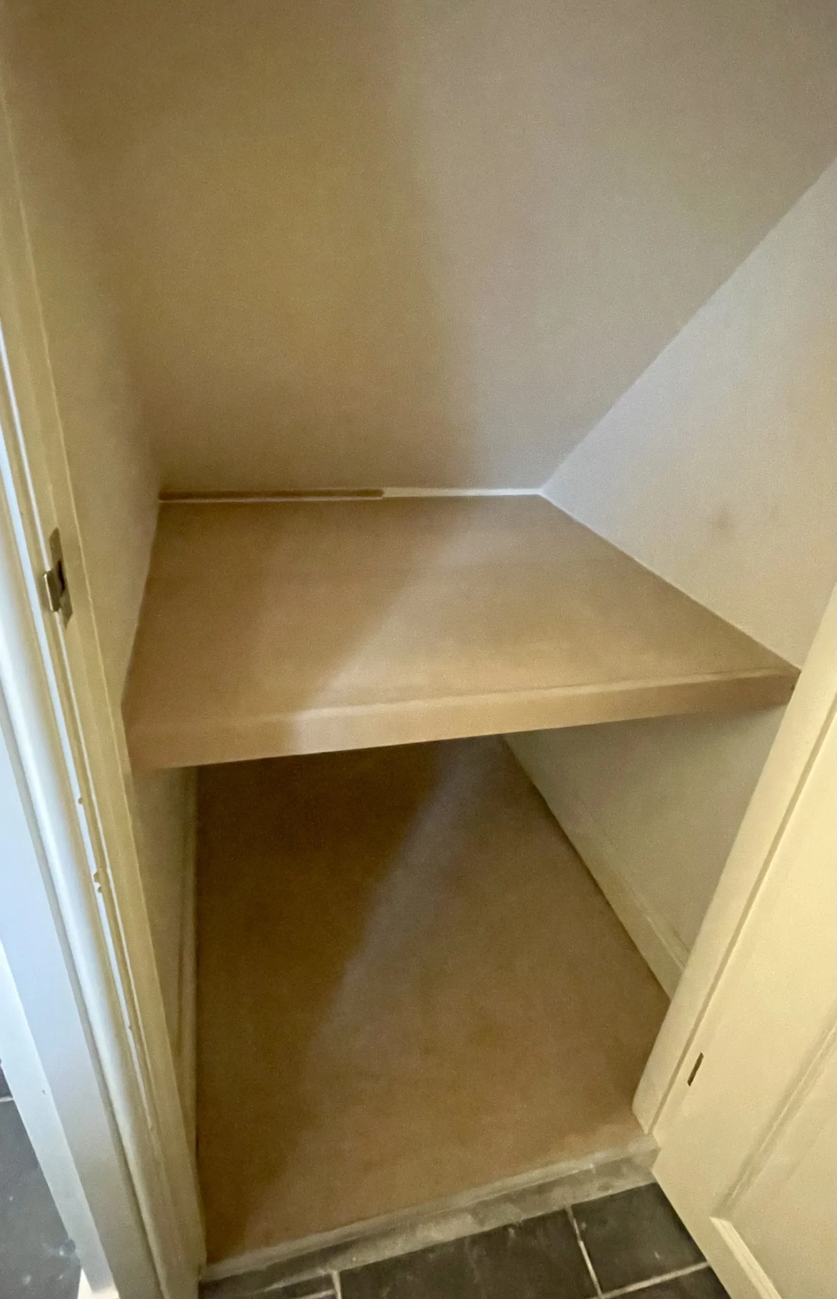 Shelving inside the finished under-stairs storage