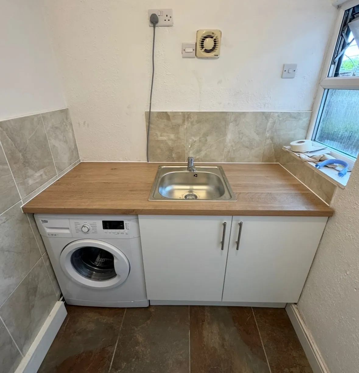 Upgraded kitchen utility area in Moira with new worktop, sink and appliance space