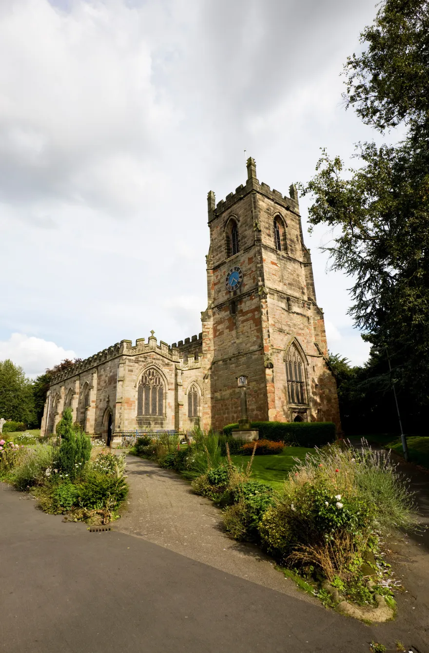 Church tower surrounded by trees in Ashby-de-la-Zouch