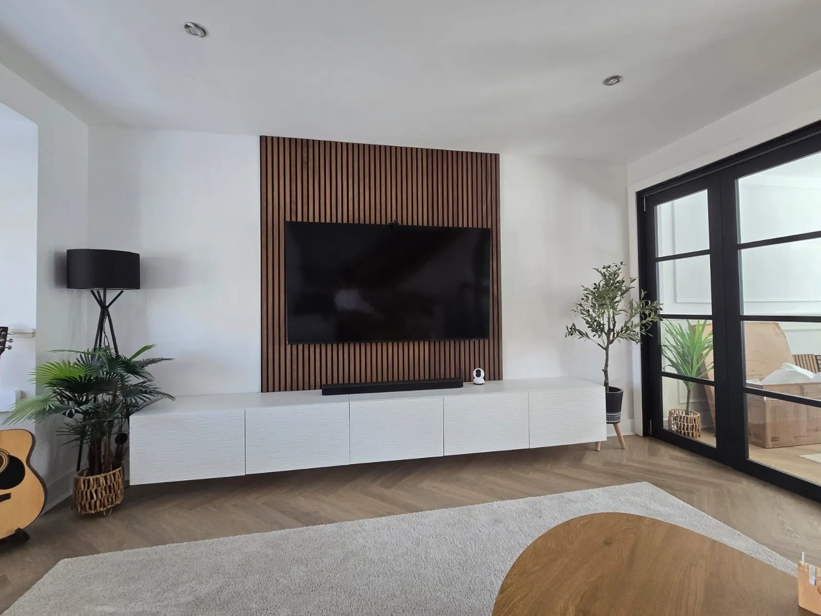 Media wall installed in Burton with a recessed television and panelled finish