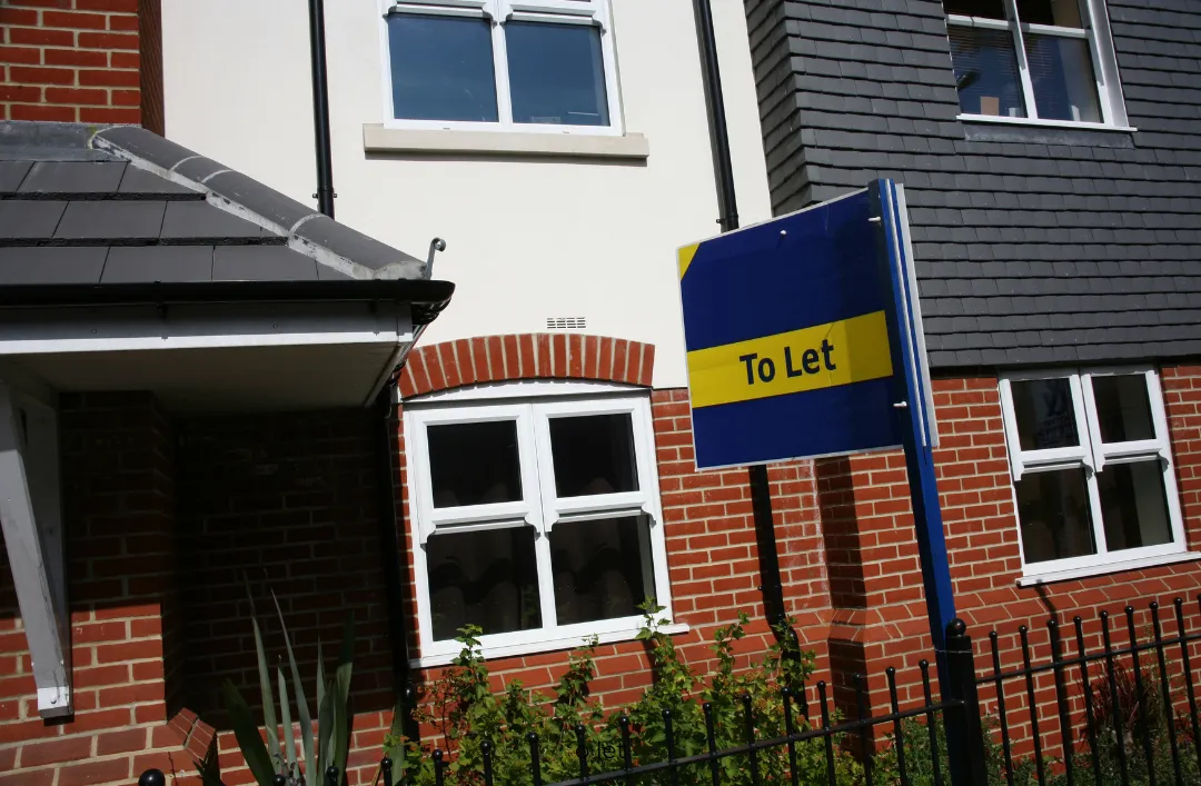 A To Let board outside a modern rental property